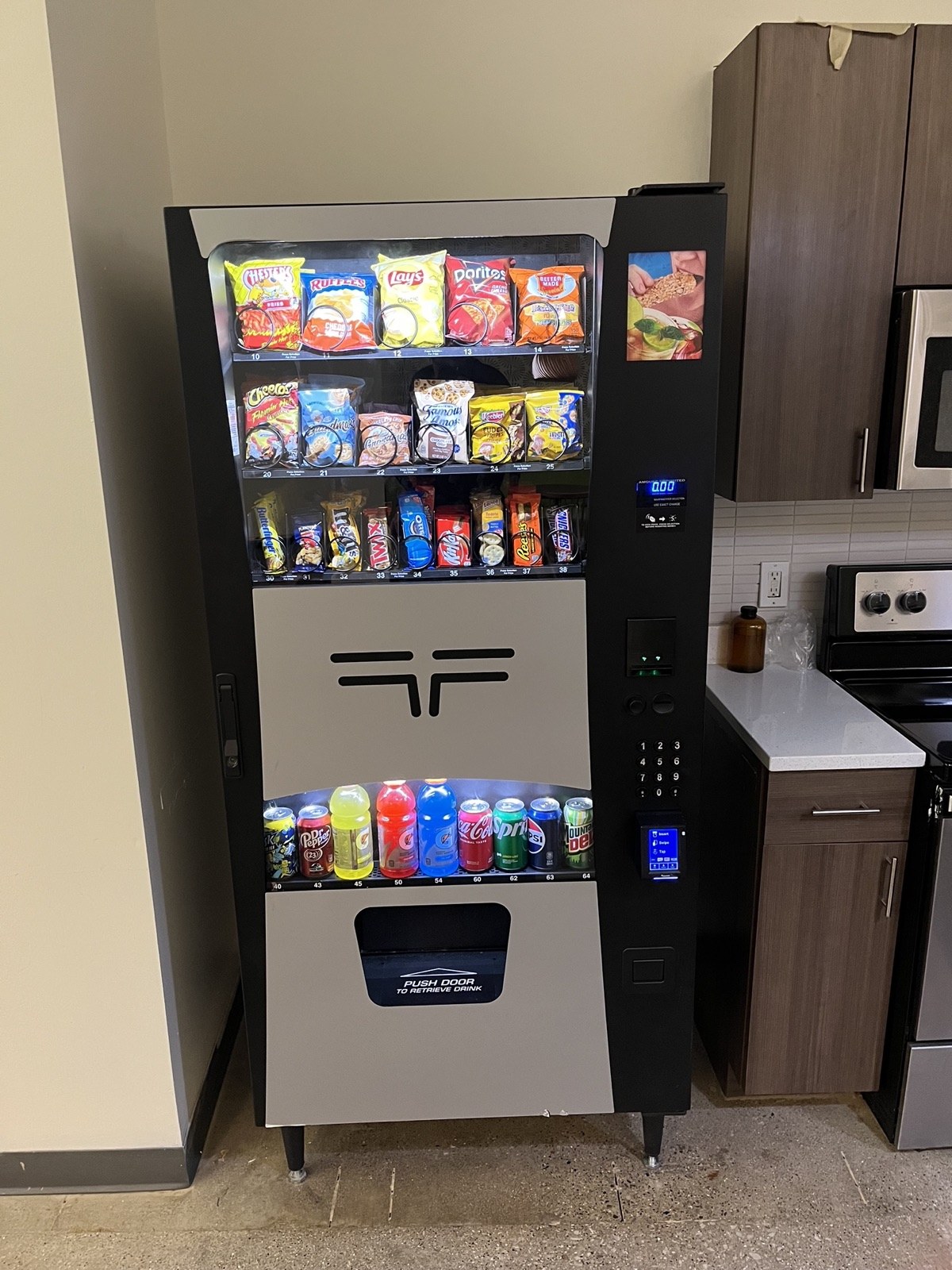 Valiant Vending combo snack and drink machine installed in a break room